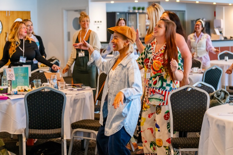 Women networking at a Scaling Secrets event