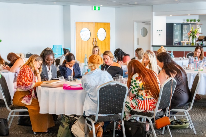 Women collaborating at an SMM event